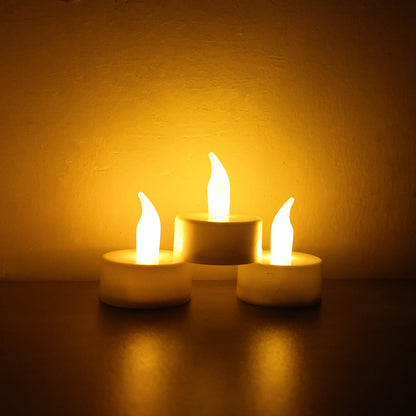 Six Wukusy LED flameless tealight candles for home decor, showcasing warm, flickering light in a cozy setting.