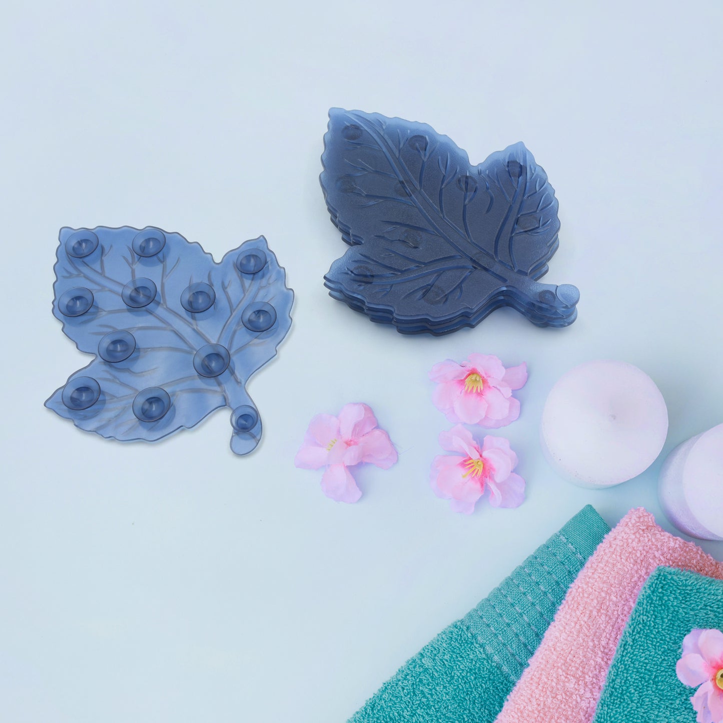Set of four star leaf-shaped PVC anti-slip baby bath mats by Wukusy, designed for child safety in the shower or bath.