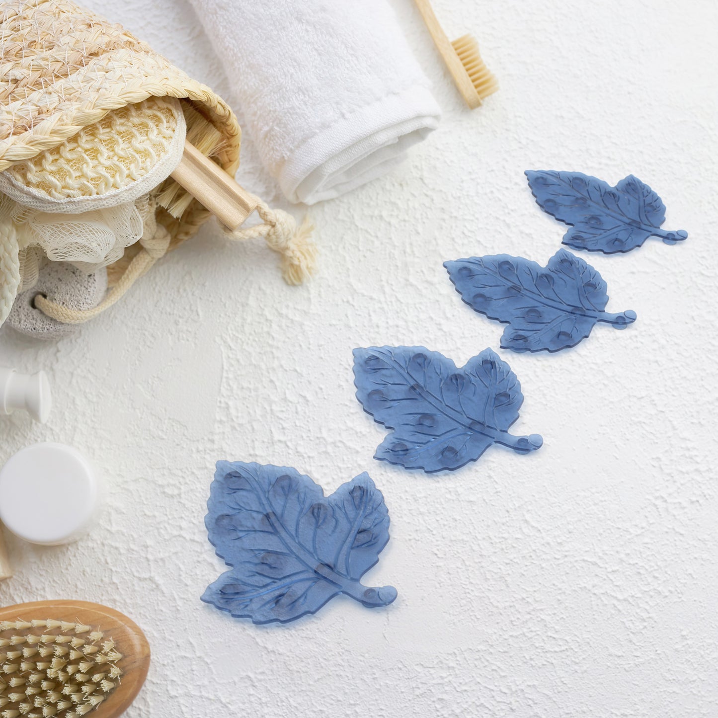 Set of four star leaf-shaped PVC anti-slip baby bath mats by Wukusy, designed for child safety and non-slip shower use.