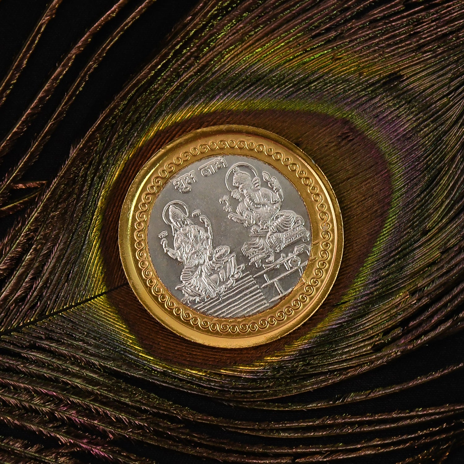 Gold and silver dual-tone religious coin featuring Lakshmi and Ganesh design, ideal for home decor accents.