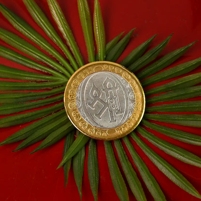 Premium gold and silver dual-tone religious coin featuring Lakshmi and Ganesh design, ideal for home decor.