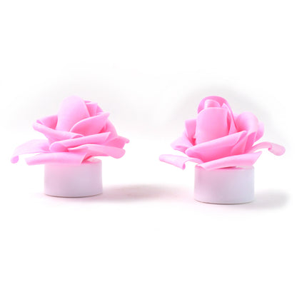 Two rose flower-shaped LED flickering tealight candles from Wukusy, ideal for home decor with a warm, flickering glow.