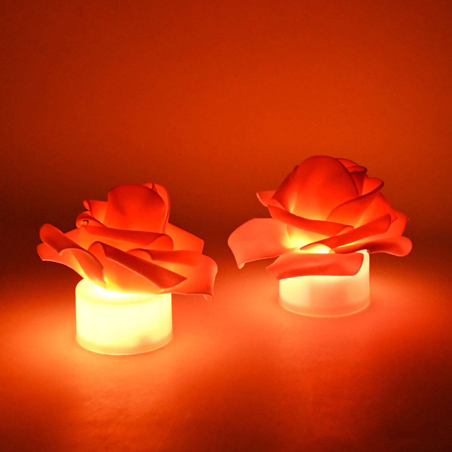 Set of two Wukusy rose-shaped LED flickering tealight candles for home decor, with warm, flickering light and floral design.