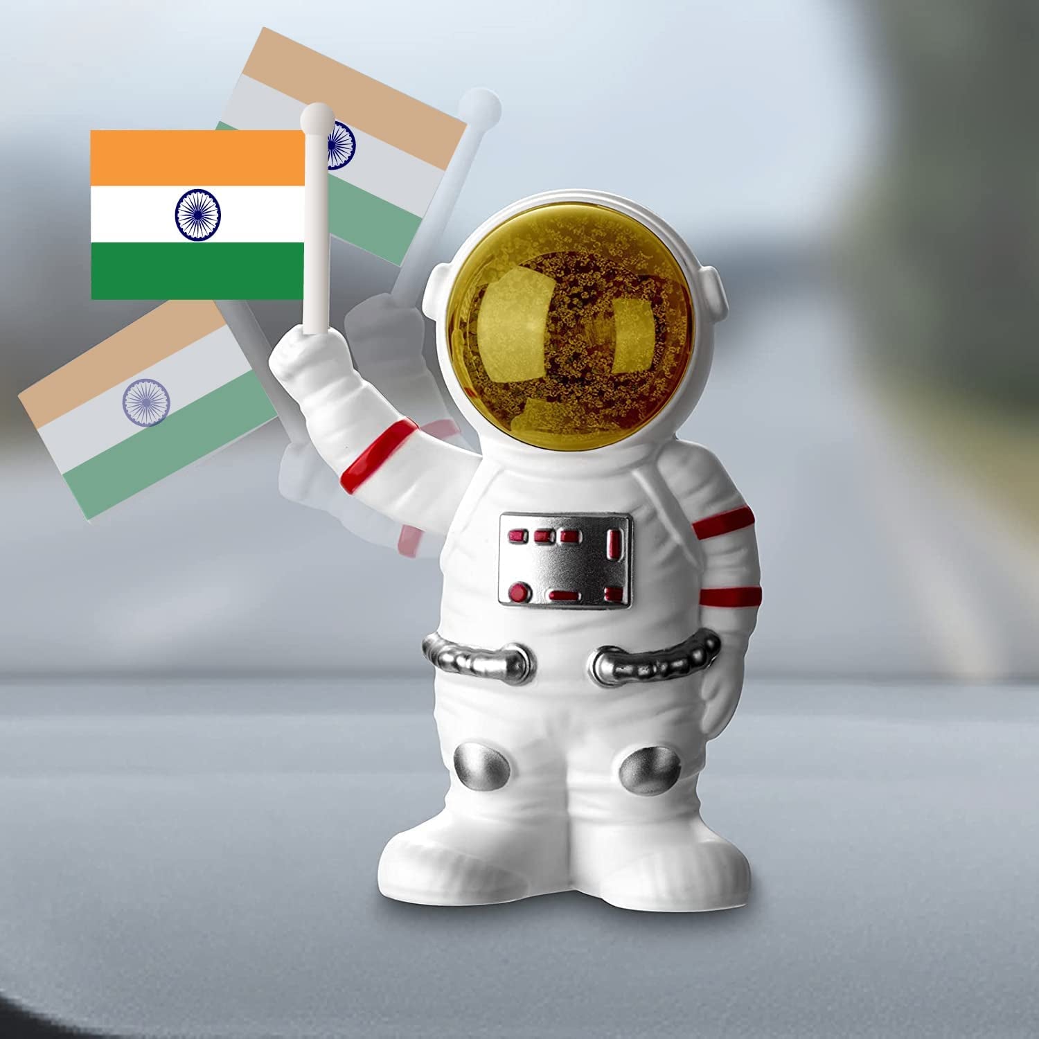Solar power astronaut ornament by Wukusy with moving hand and Indian flag, ideal for home decor displays.