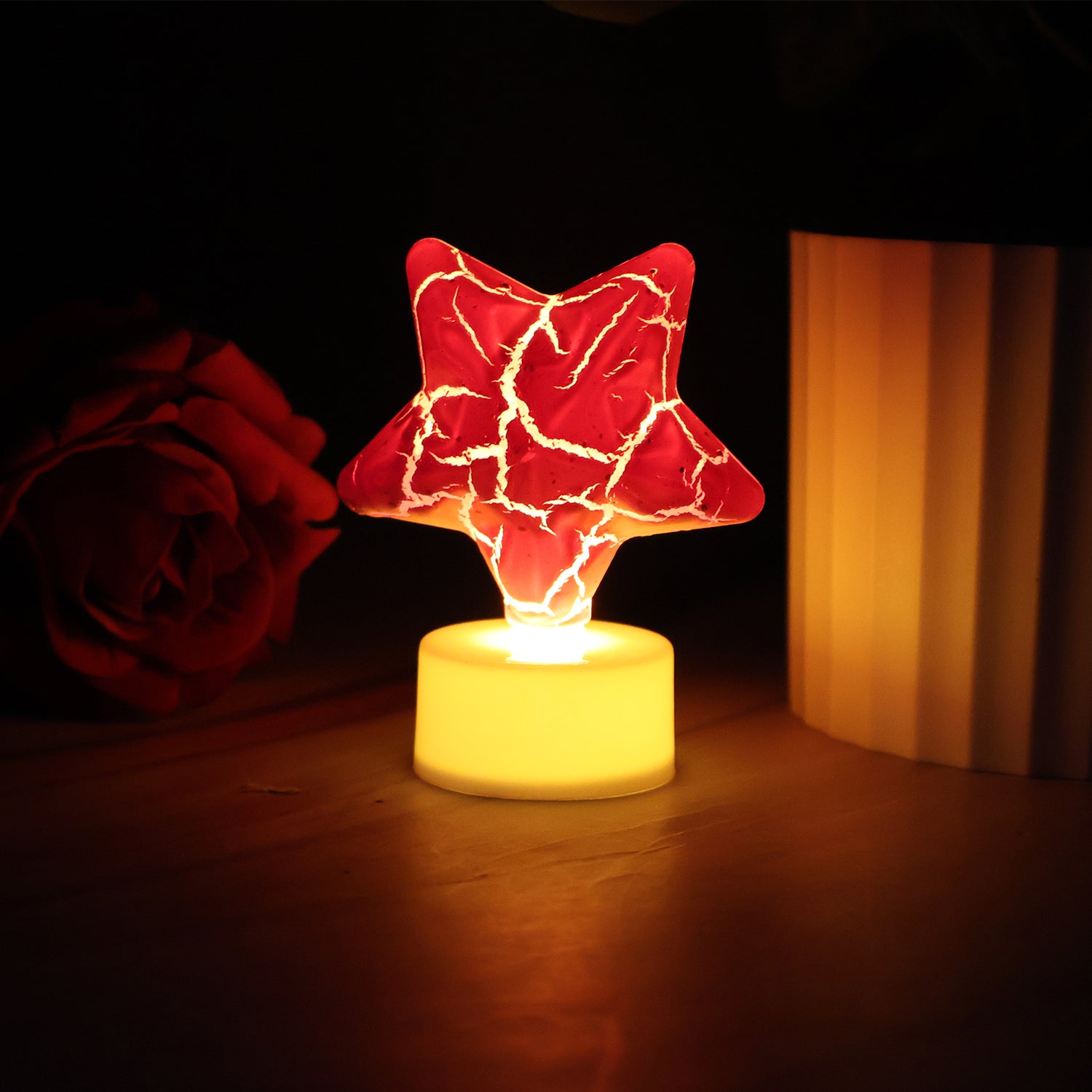 Set of 12 Wukusy star-shaped decorative LED tealight candles for home decor, glowing ambient light for cozy spaces.