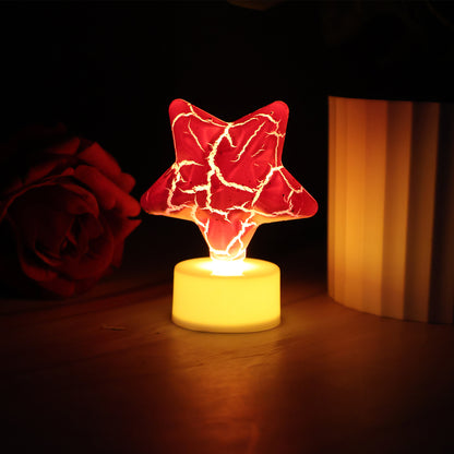 Set of 12 Wukusy star-shaped decorative LED tealight candles for home decor, glowing ambient light for cozy spaces.