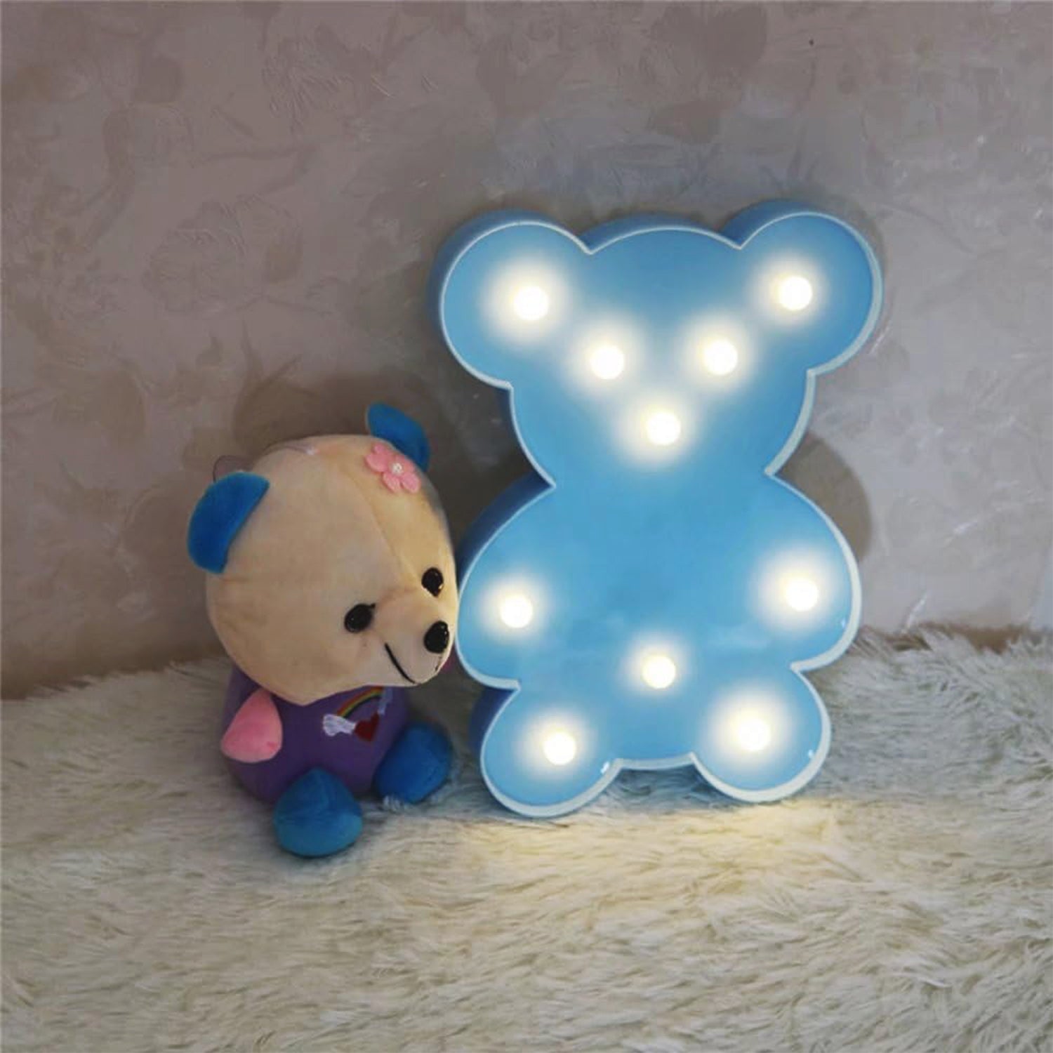 Wukusy teddy bear shape LED night light for home decor, soft glowing plush design suitable for children's room or cozy spaces.