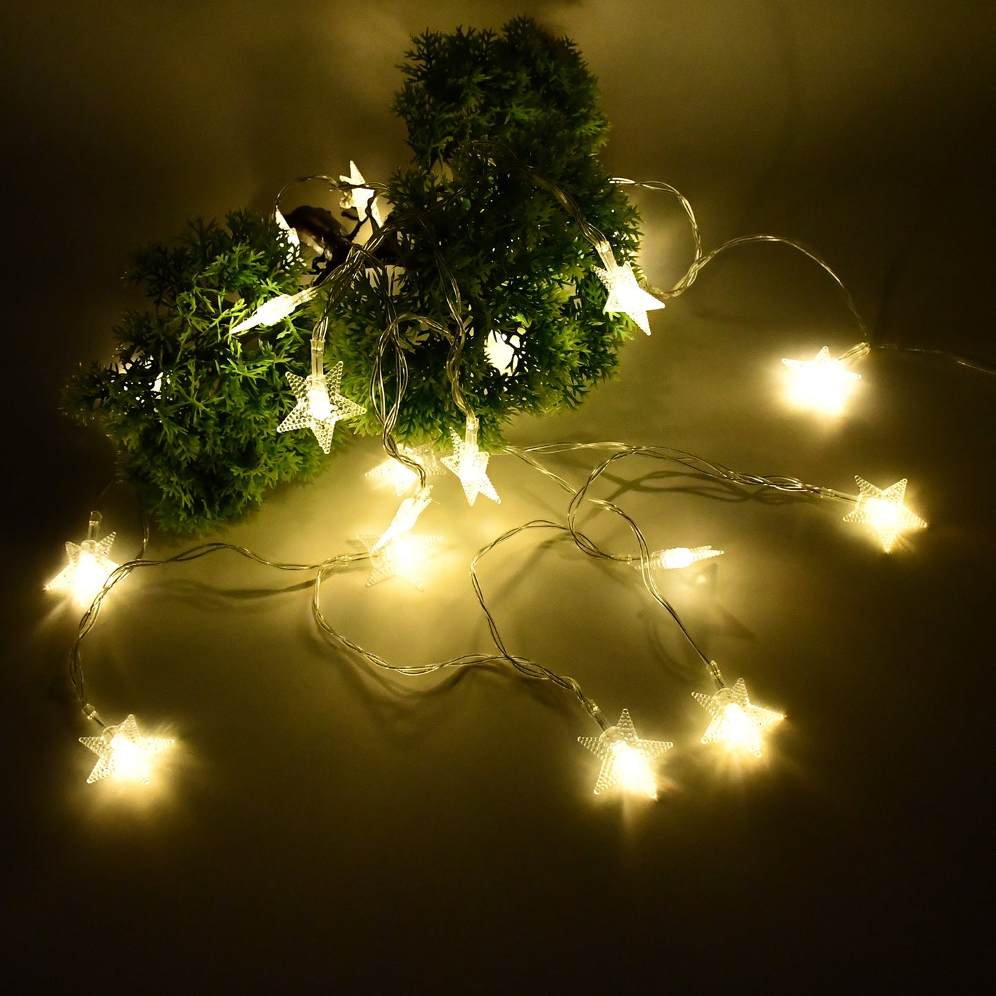 Wukusy USB-powered 20 LED decorative star string fairy lights for home decor, glowing with soft, warm light.