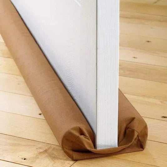 Wukusy twin door draft stopper guard placed at door bottom to prevent drafts and improve home insulation.