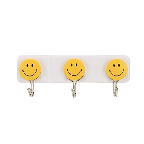 Set of three Wukusy self-adhesive smiley face wall hooks for home improvement, shown attached to a wall surface.