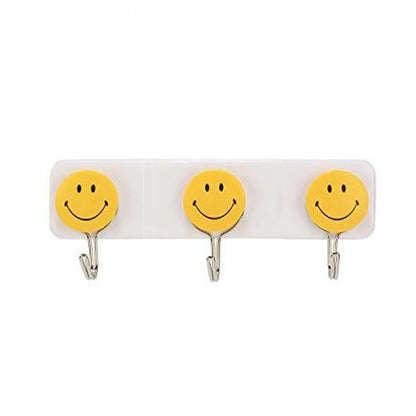 Set of three Wukusy self-adhesive smiley face wall hooks for home improvement, shown attached to a wall surface.