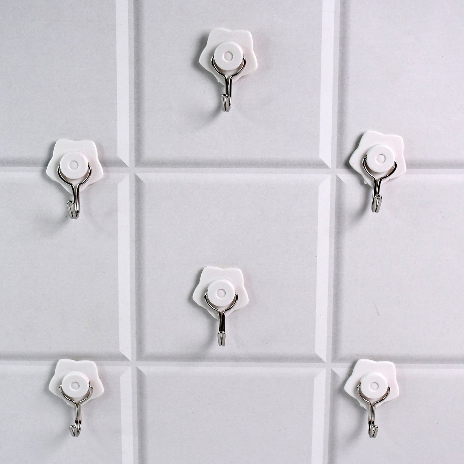 Set of six Wukusy multipurpose self-adhesive plastic wall hooks for home improvement, shown attached to a wall for versatile use.