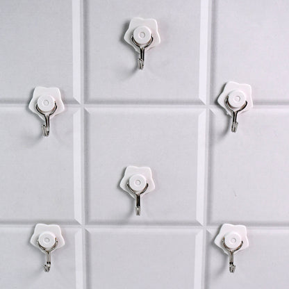 Set of six Wukusy multipurpose self-adhesive plastic wall hooks for home improvement, shown attached to a wall for versatile use.