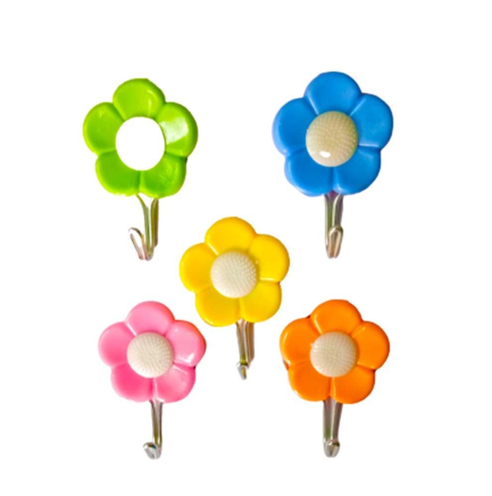 Set of 5 Wukusy plastic self-adhesive flower-shaped hooks for home improvement, suitable for hanging lightweight items.