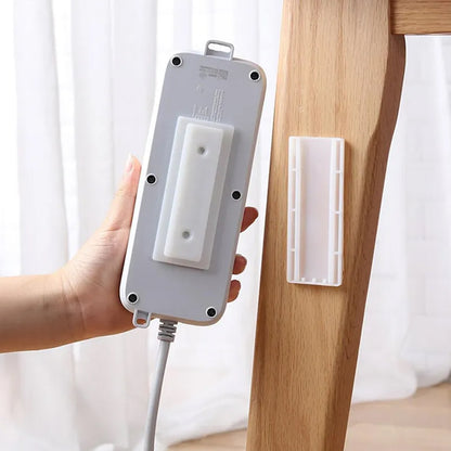 Wukusy 1208 self-adhesive wall mount plug organizer for home office, reusable, no residue, multiuse device, no holes needed.