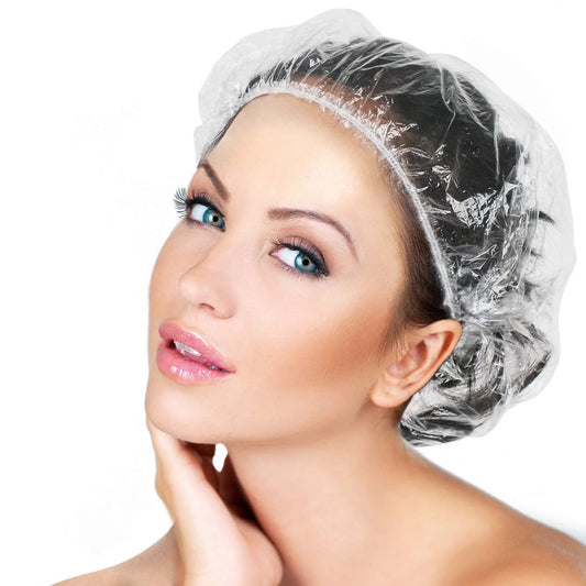 Clear disposable plastic shower cap with elastic band, thick and waterproof, designed for women’s spa, hotel, or hair salon use by Wukusy.