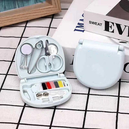 Wukusy mini travel sewing kit with threads, scissors, needles, and a plastic box for emergency sewing and repairs.