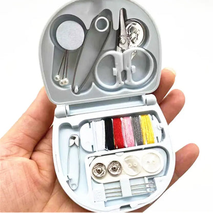Wukusy mini travel sewing kit with plastic box, includes threads, scissors, needles, and tools for DIY sewing and repairs.