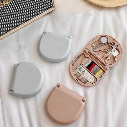Wukusy mini travel sewing kit with plastic box, containing scissors, sewing needles, threads, and repair tools for beginners.