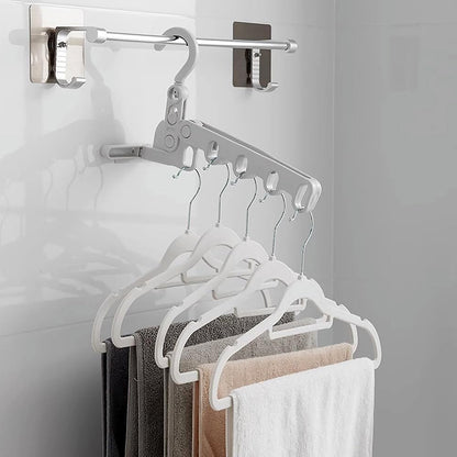 Wukusy 5-hole foldable travel clothes hanger, space-saving wall-mounted multifunctional clothes rack for indoor and travel use.