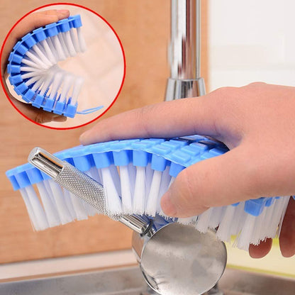 Wukusy flexible plastic cleaning brush for kitchen and bathroom cleaning, with ergonomic handle and durable bristles.