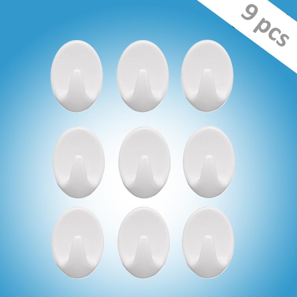 Wukusy 1544 self-adhesive plastic wall hook set for home and kitchen, pack of 9, mounted on wall for hanging items.