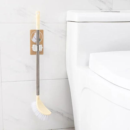 Wukusy Magic Sticker Series self-adhesive mop and broom holder for home organization, mounted on a wall for easy cleaning tool storage.