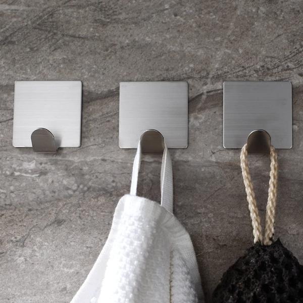 Wukusy 1660 heavy-duty self-adhesive hooks, pack of 3, for home improvement, shown attached to a wall surface.