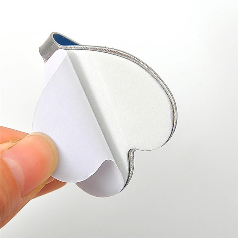 Set of three Wukusy heavy duty self-adhesive hooks for home improvement, featuring durable sticky hooks for hanging items.