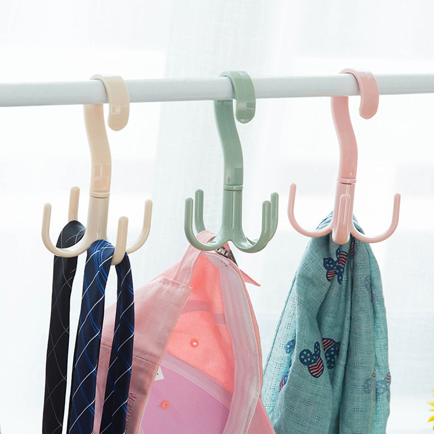 Wukusy 1714 4-claw multi-function purse rack and handbag hanger hook, rotatable 360 degrees for home organization.