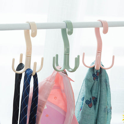 Wukusy 1714 4-claw multi-function purse rack and handbag hanger hook, rotatable 360 degrees for home organization.