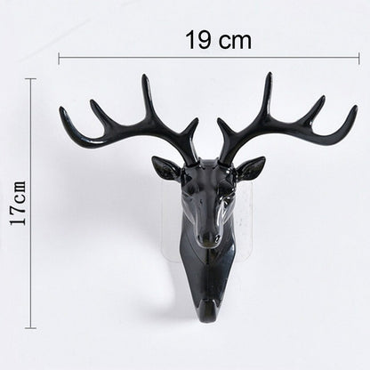 Wukusy deer head self-adhesive wall door hook hanger for home improvement, mounted on a door for hanging items.