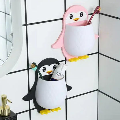 Wukusy Penguin Storage Box and Wall Mount for remote controls, electric toothbrushes, and universal controllers on a wall or nightstand.