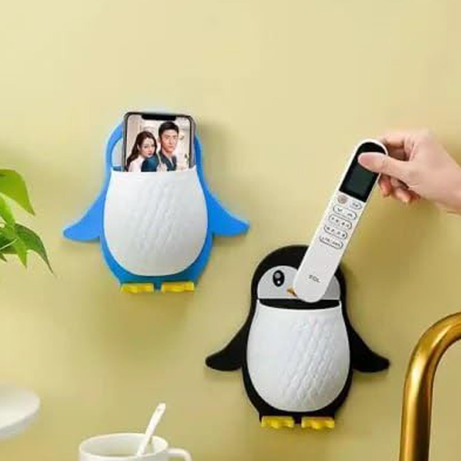 Wukusy penguin-shaped plastic storage box for remote controls, electric toothbrushes, and small items, wall-mounted for home organization.