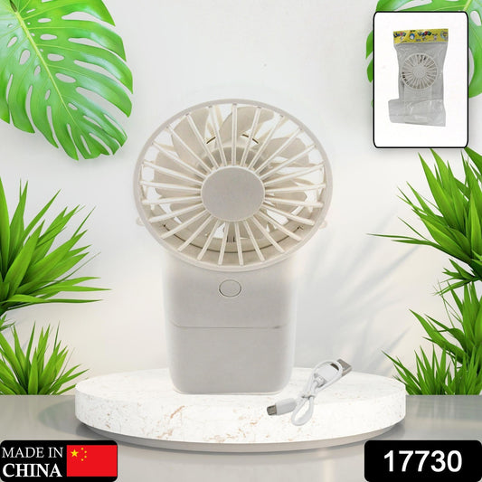 Wukusy portable handheld electric fan with 3 modes, USB rechargeable, compact mini fan for personal use and home improvement.