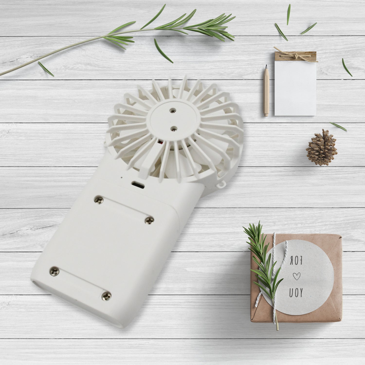 Wukusy portable small electric handheld fan with 3 modes, USB rechargeable, compact personal fan for home or outdoor use.