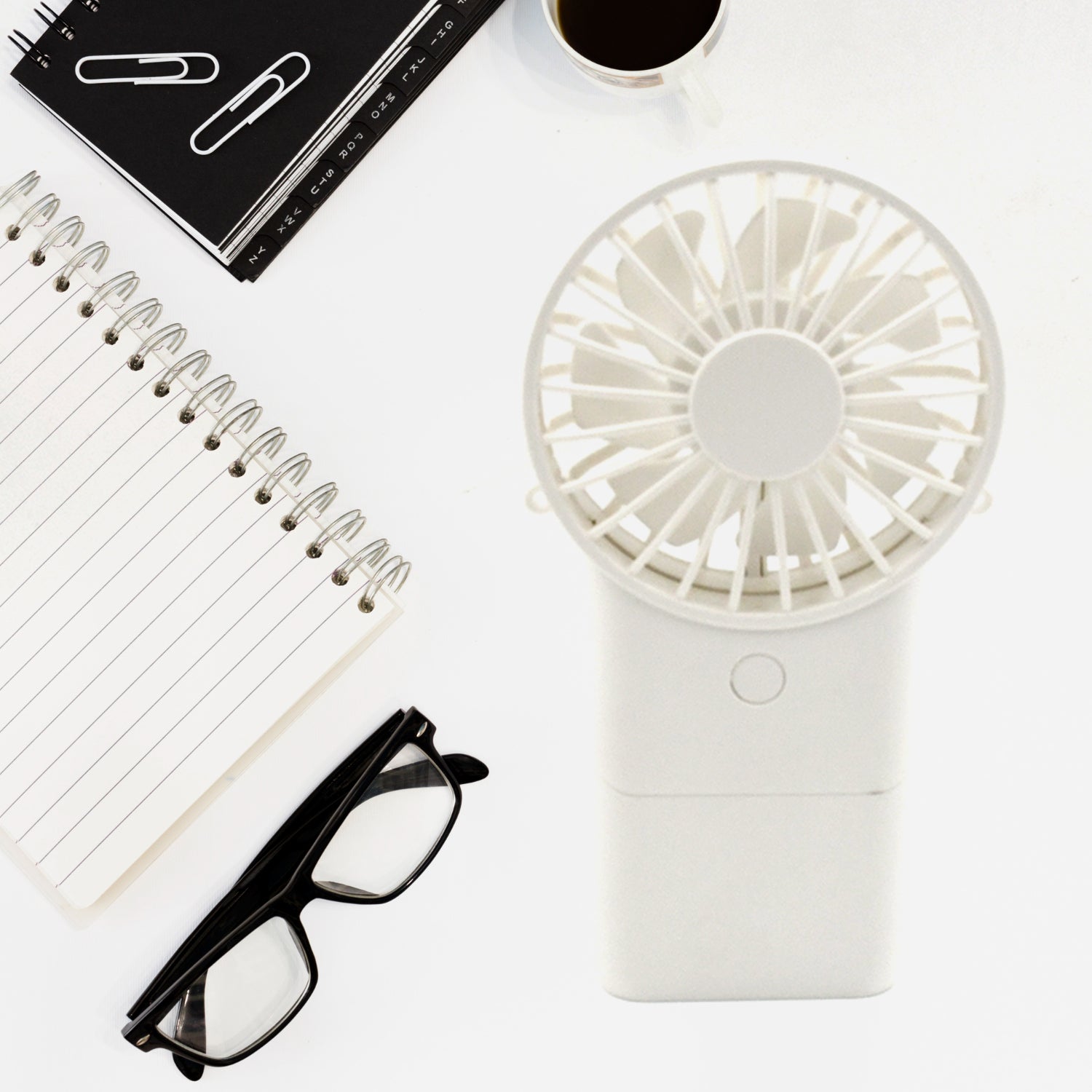 Wukusy portable handheld electric fan with three modes, compact USB rechargeable personal fan for home and student use.