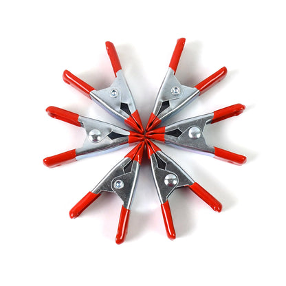 Set of six 2-inch heavy-duty metal spring clamps by Wukusy for home improvement projects, showcasing their sturdy design.