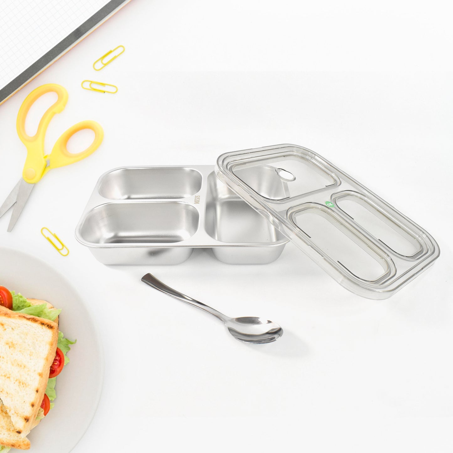 Wukusy 3-compartment transparent stainless steel lunch box for kids, durable with separate sections for meals and snacks.