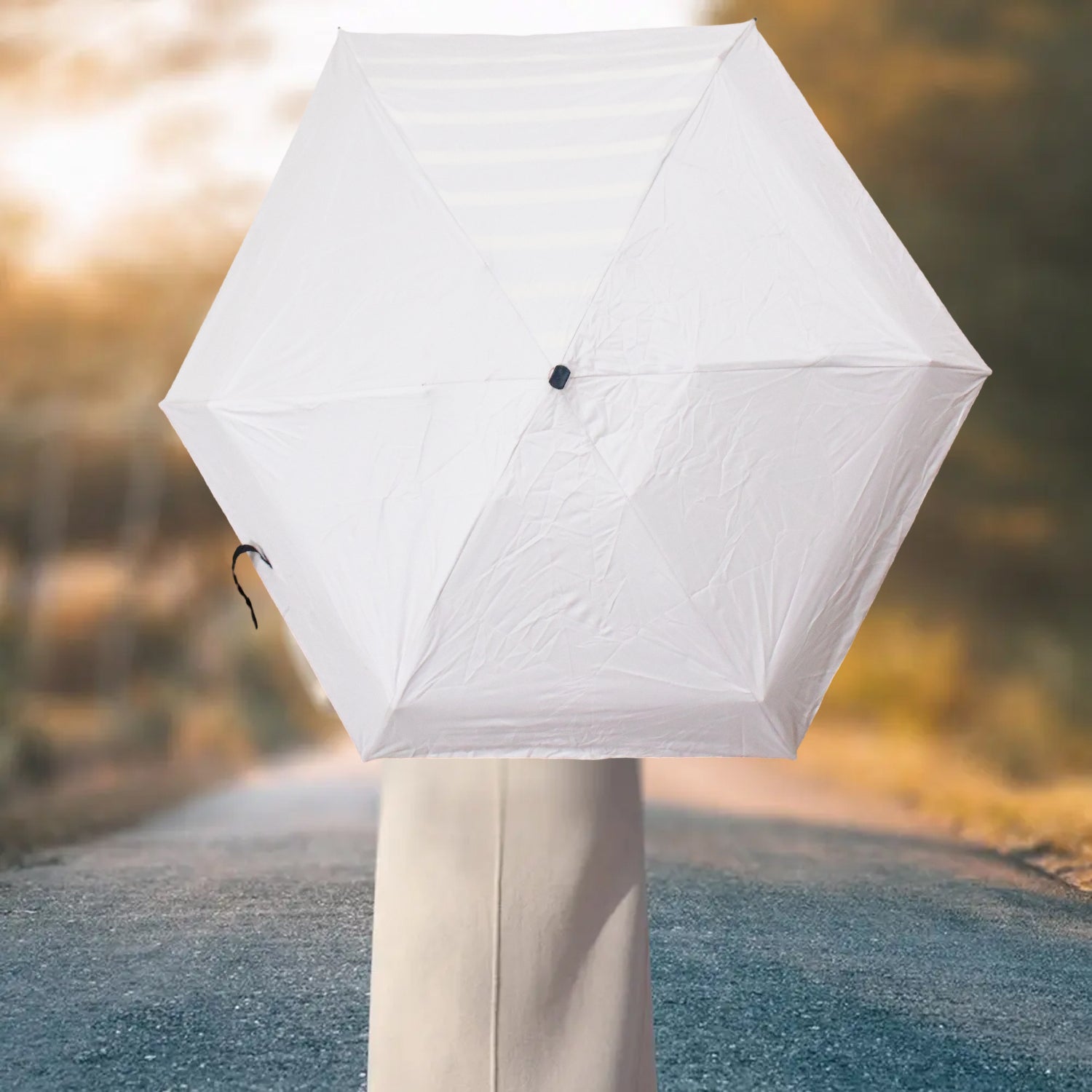 Wukusy 3-fold sun and rain protective solid foldable umbrella open, showing its compact design and sturdy canopy for home improvement.