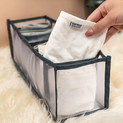 Wukusy Clothes Organizer with 7-grid drawers, foldable wardrobe storage for jeans and clothes in a closet or wardrobe cabinet.