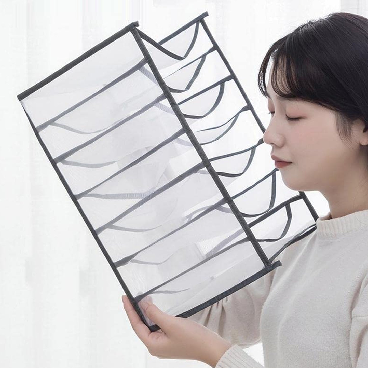 Wukusy clothes organizer with 7-grid drawers for wardrobe storage, portable and foldable for jeans and closet organization.