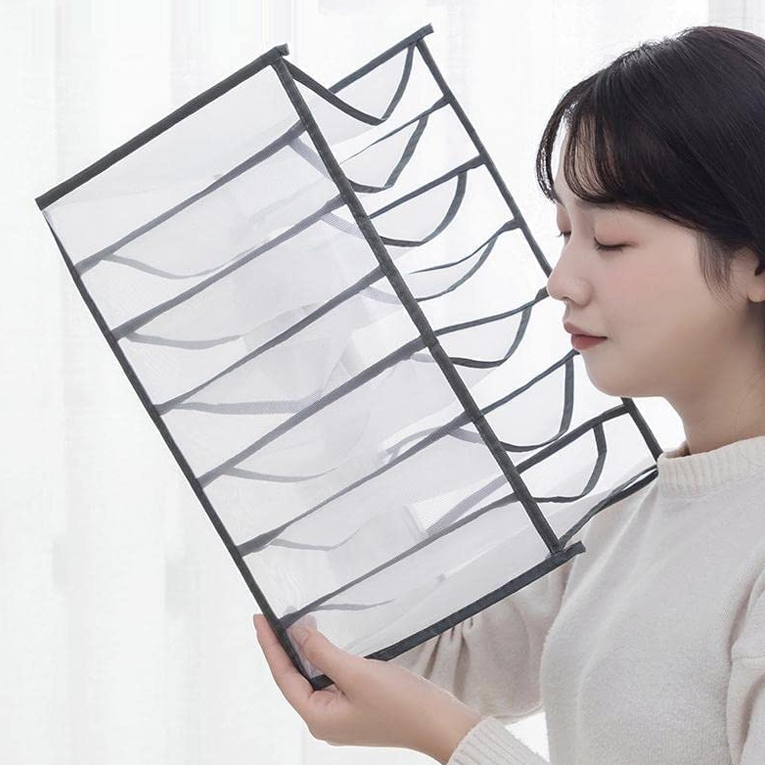 Wukusy clothes organizer with 7-grid drawers for wardrobe storage, portable and foldable for jeans and closet organization.