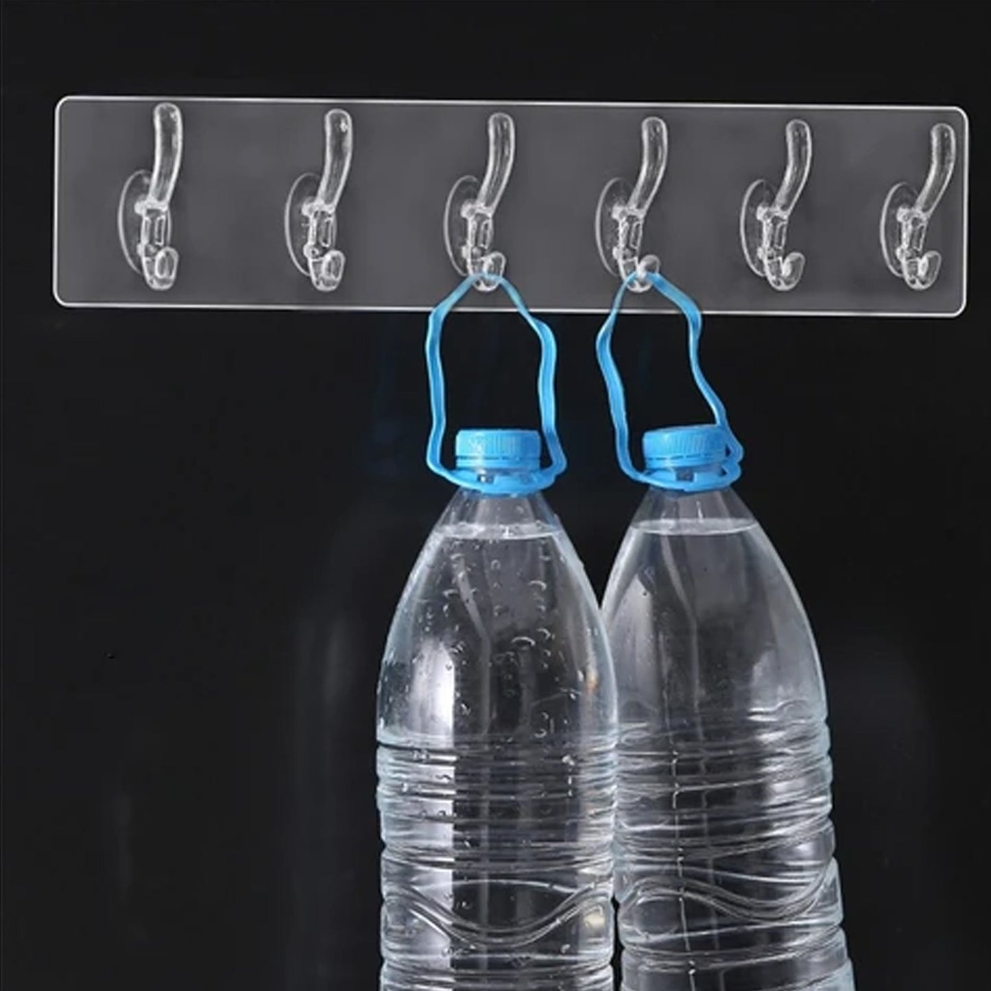 Wukusy adhesive transparent heavy-duty wall hook mounted on a wall, ideal for home improvement and hanging lightweight items.
