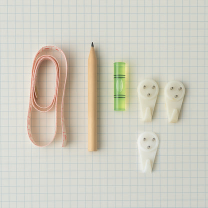 Wukusy 6-in-1 wall hanging measurement tool kit for home improvement, includes measuring tape, level, and other tools.