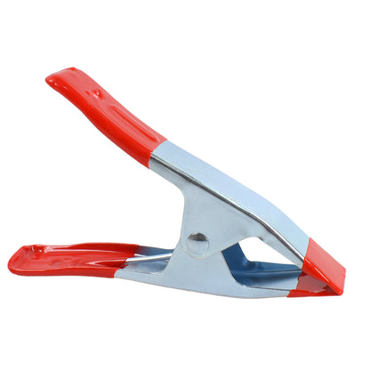 Heavy-duty 6-inch metal spring clamp from Wukusy, ideal for home improvement projects, with a strong spring mechanism.