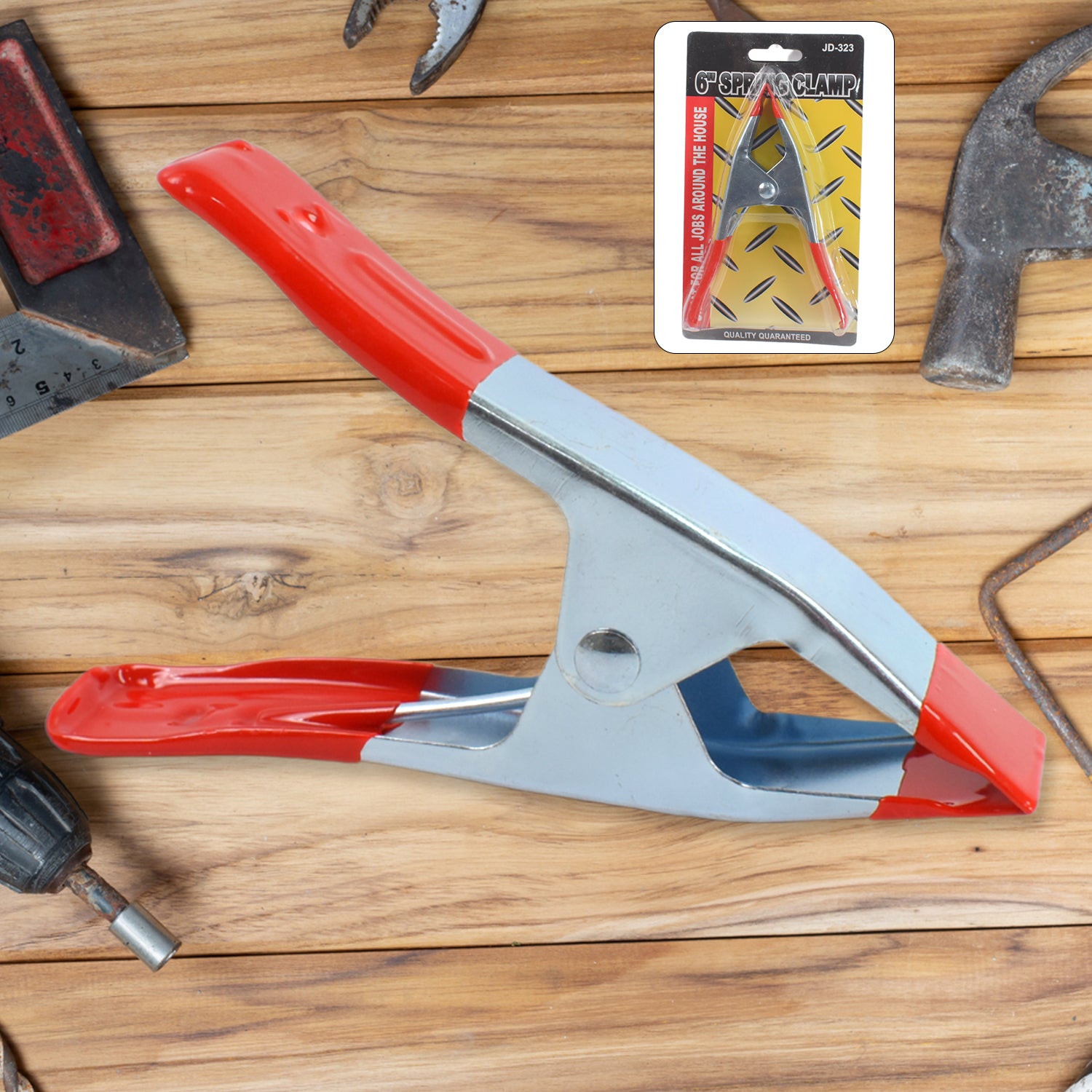 Heavy duty 6-inch metal spring clamp from Wukusy, ideal for home improvement projects, showcasing the clamp's spring mechanism.