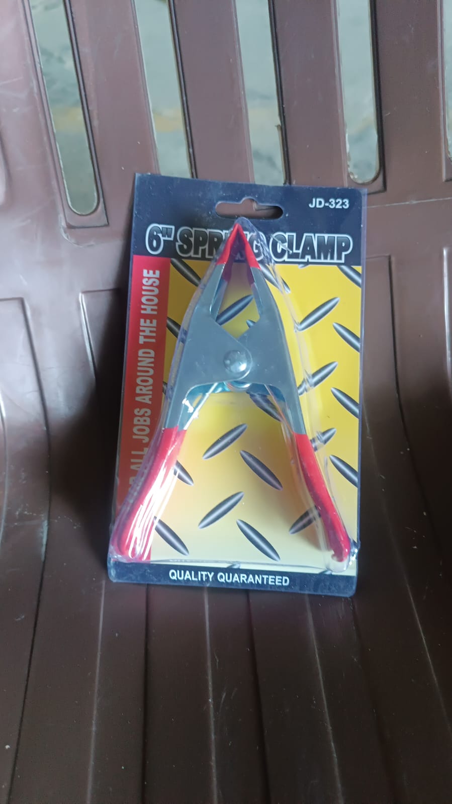 Heavy-duty 6-inch metal spring clamp from Wukusy, ideal for home improvement projects, showing the clamp's sturdy construction.