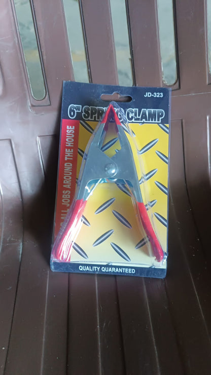 Heavy-duty 6-inch metal spring clamp from Wukusy, ideal for home improvement projects, showing the clamp's sturdy construction.
