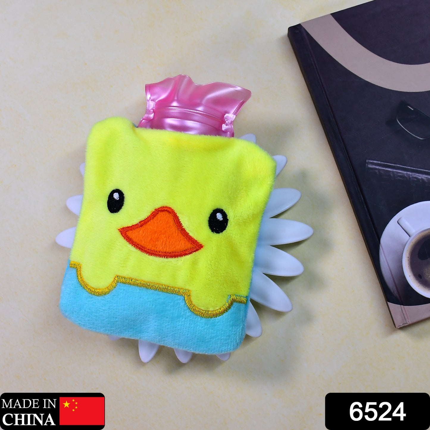 Yellow duck design small hot water bag with cover by Wukusy, used for pain relief, neck, shoulder, and menstrual cramps.